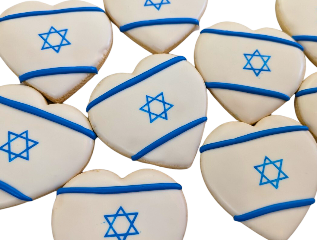 A collection of Israel flag heart cookies decorated with the Star of David and a blue stripe, representing the Israeli flag.