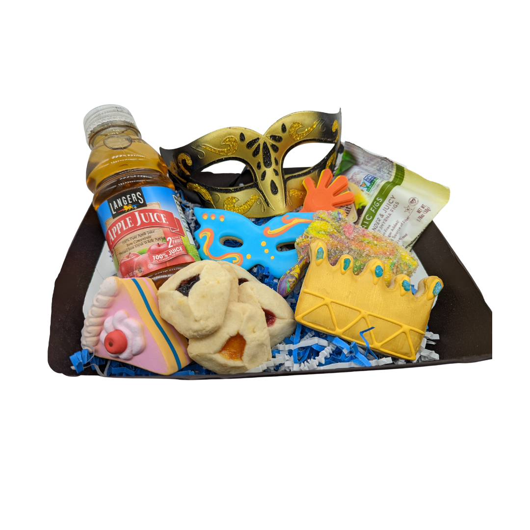 A Deluxe Mishloach Manot package with a variety of items including cookies, juice, dried fruit, a mask, toy, and mini clapper/grogger arranged in a basket.