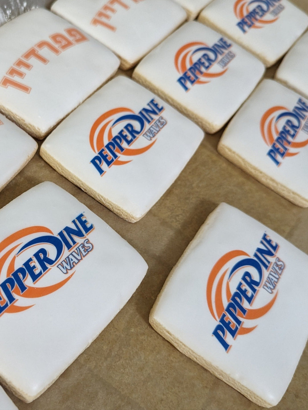 Cookies with Pepperdine University logo on a baking sheet